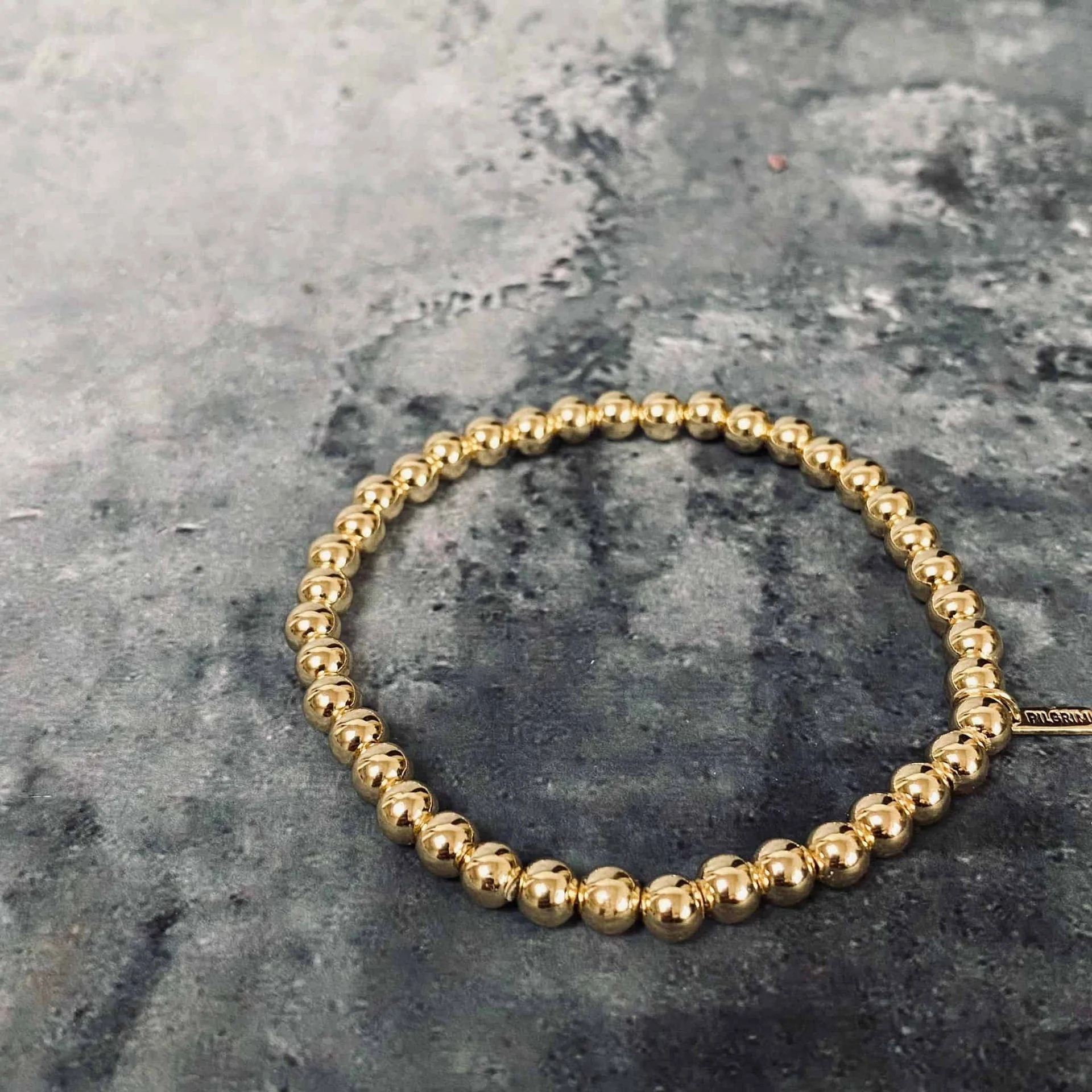 14 karat Gullbelagt armbånd satt sammen av sirlige perler